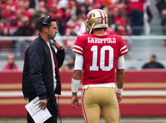 49ers coach Kyle Shanahan talks with quarterback Jimmy Garopollo